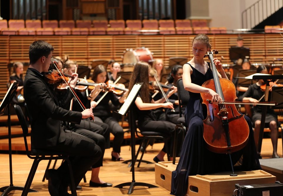 cellist-solo-performing-with-orchestra