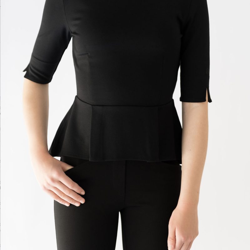 girl wearing black peplum top and black pant
